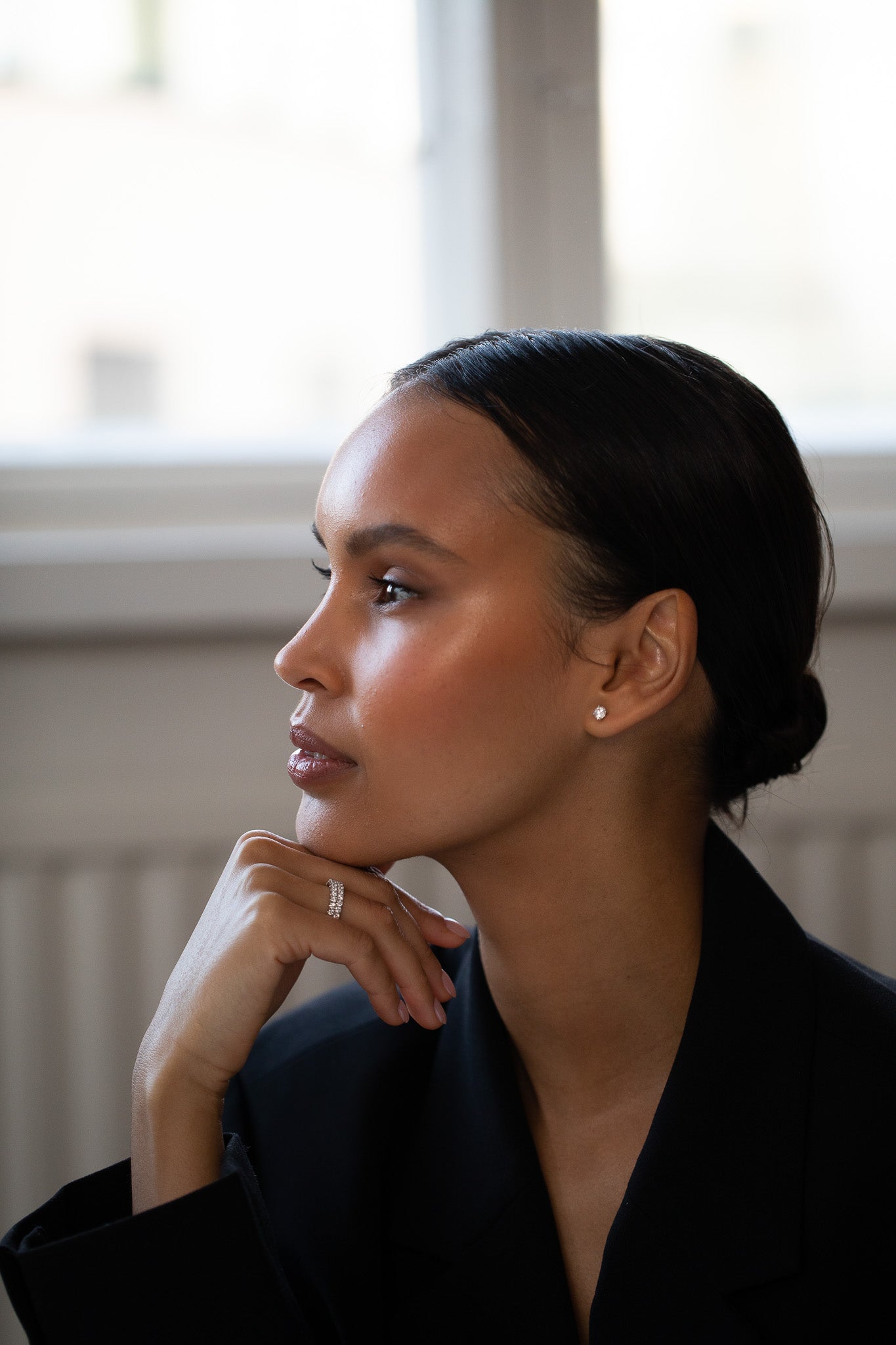 Elegant woman wearing lab-grown diamond Eternity Diamond Rings in sizes Petite and Large.