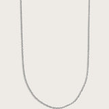 Simple silver chain necklace displayed on a light beige background.