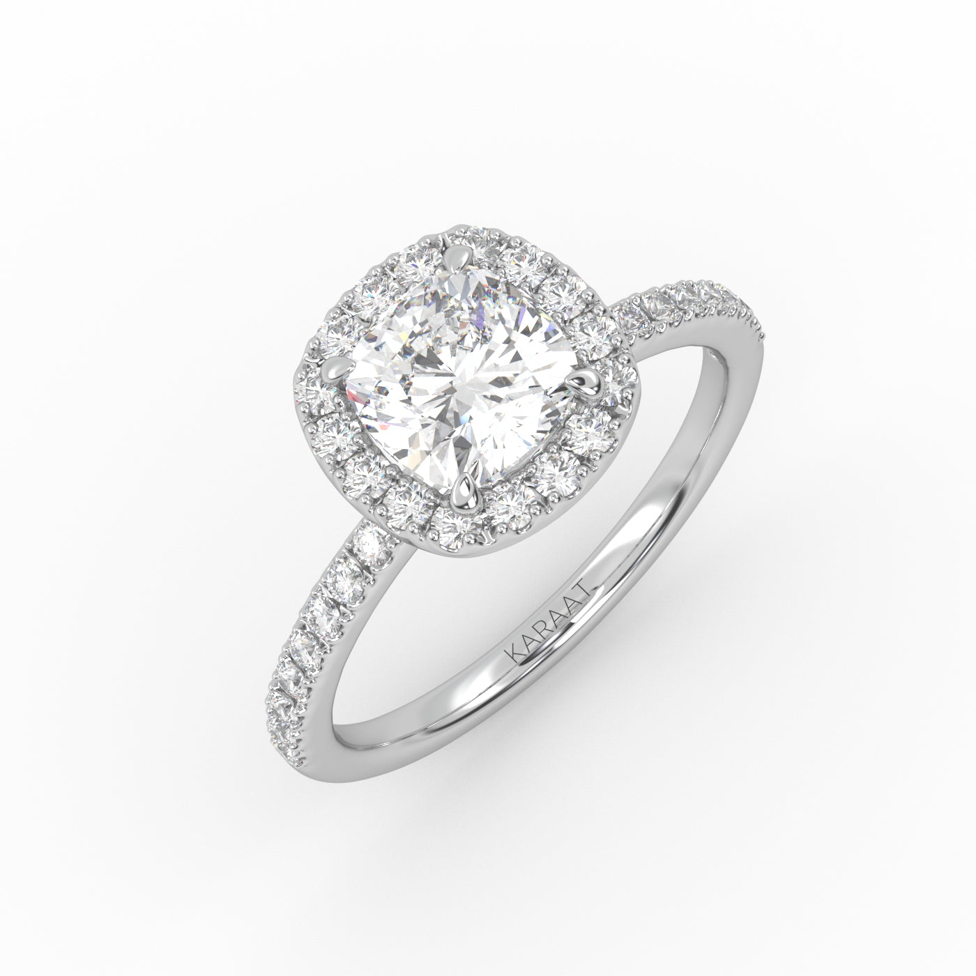 Elegant cushion-cut diamond solitaire engagement ring in white gold with a diamond Pavé band and Halo design.