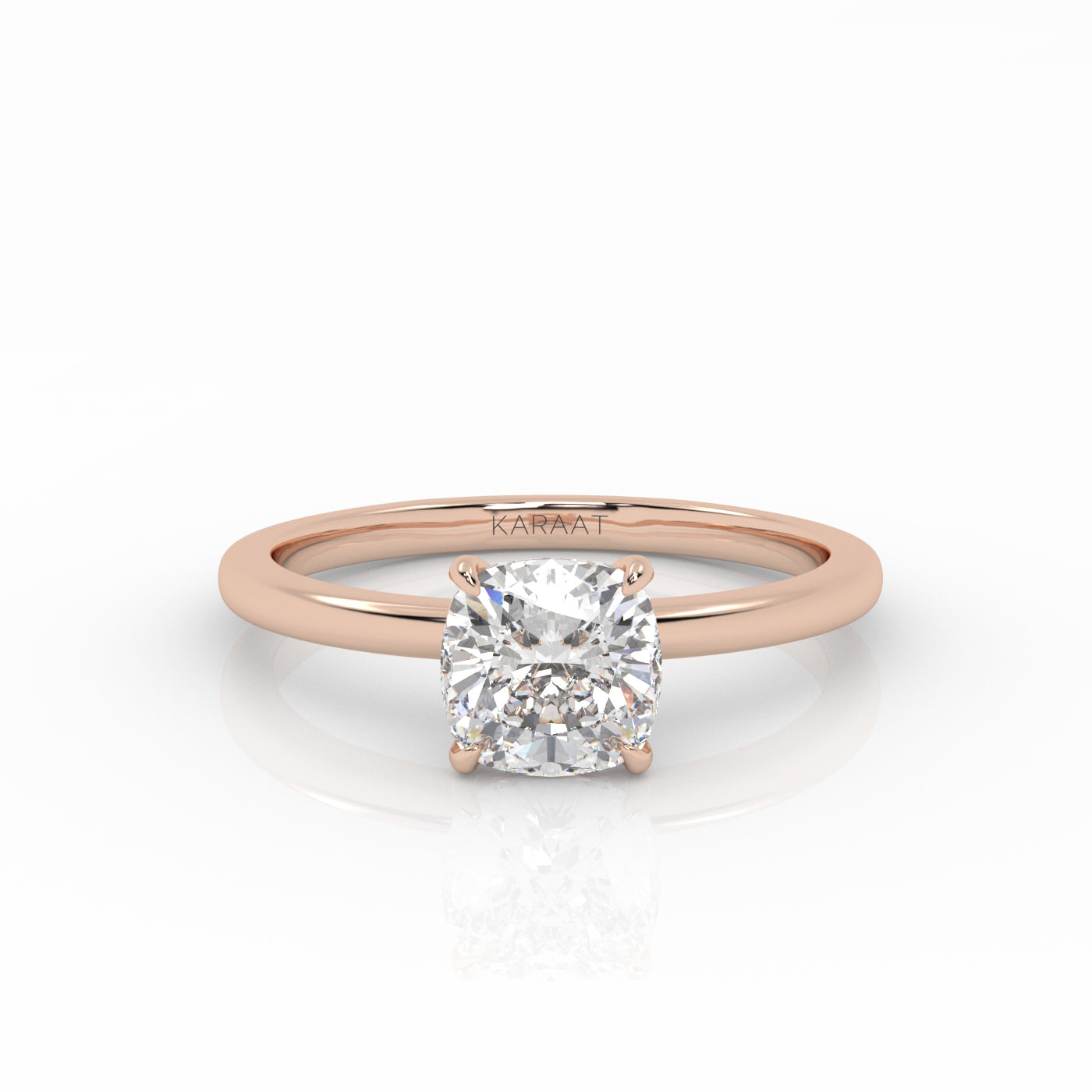 Lab-grown diamond engagement ring with a 1 carat cushion cut diamond in the rose gold band.