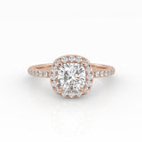 A refined cushion-cut diamond with Halo in a rose gold pavé band setting.