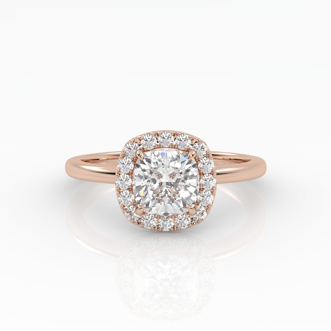 A dazzling cushion-cut diamond nestled on a sparkly halo setting and sophisticated rose gold band.
