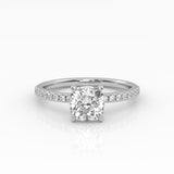 Elegant Cushion Solitaire Engagement Ring with sparkling pavé band shown in white gold.