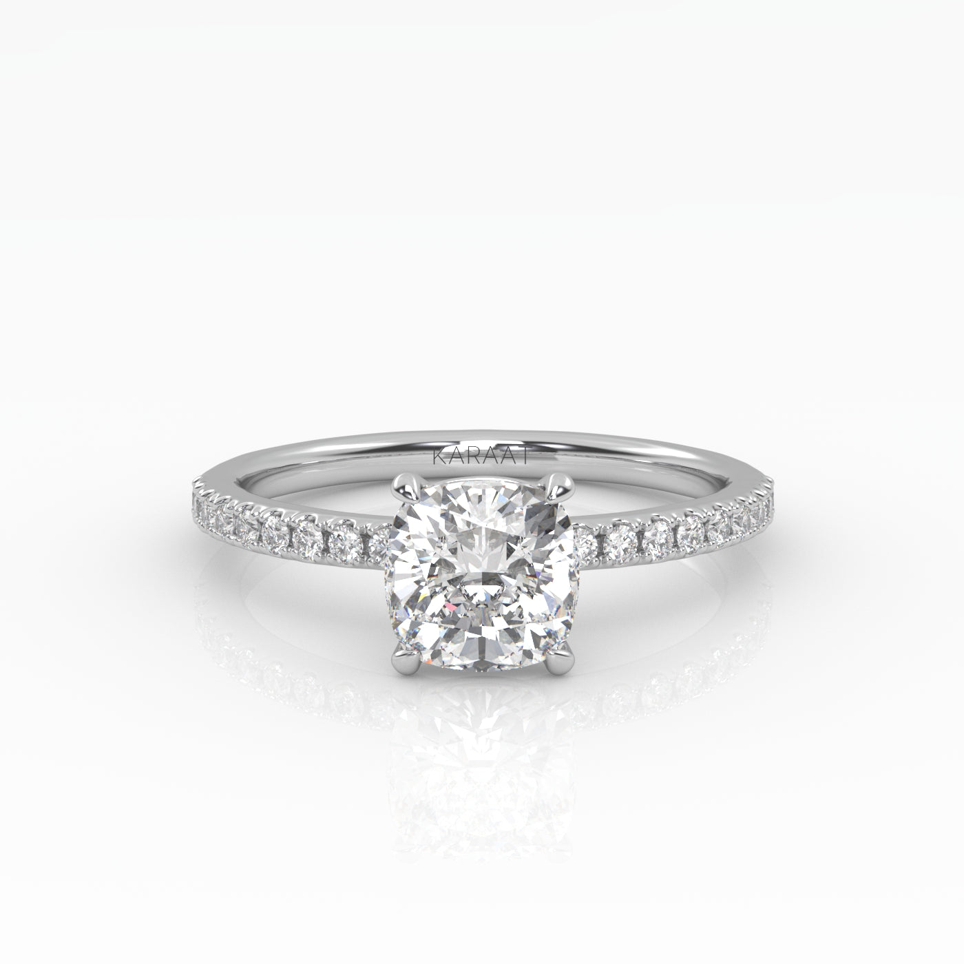 Elegant Cushion Solitaire Engagement Ring with sparkling pavé band shown in white gold.