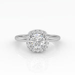 A gleaming cushion-cut diamond engagement ring set in elegant solitaire with halo style.