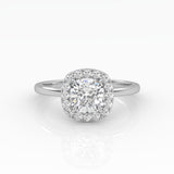 A gleaming cushion-cut diamond engagement ring set in elegant solitaire with halo style.