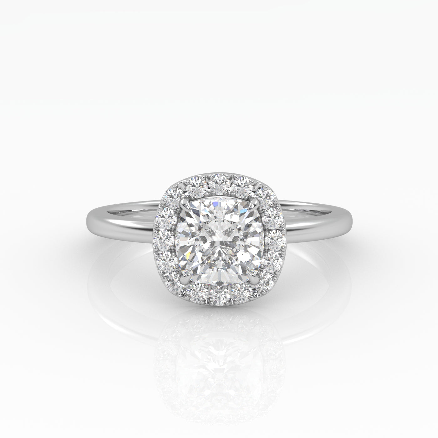 A gleaming cushion-cut diamond engagement ring set in elegant solitaire with halo style.