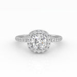 A dazzling cushion-cut diamond nestled on a stunning white gold Halo and Pavé band setting.