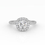 A dazzling cushion-cut diamond nestled on a stunning white gold Halo and Pavé band setting.