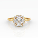 An exquisite yellow gold cushion-cut diamond ring featuring 1 carat diamond in a halo setting.