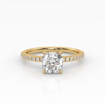 Timeless cushion-cut engagement ring with a lab-grown diamond and a delicate yellow gold pavé band.