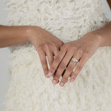 A KARAAT Oval Trilogy diamond ring in 18k rose gold, providing elegant bridal inspiration for a modern wedding.