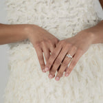 A KARAAT Oval Trilogy diamond ring in 18k white gold, providing elegant bridal inspiration for a modern wedding.