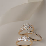 Product photography of the KARAAT Oval Trilogy in 18k white gold, detailing the precise three-stone setting.