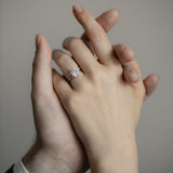 An intimate couple’s moment featuring the KARAAT Round Six Prong Solitaire engagement ring in 18k yellow gold.