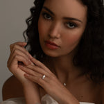 Romantic bridal styling with the KARAAT Round Trilogy three-stone diamond ring in 18k white gold.