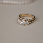 Detailed close-up of the KARAAT Round Trilogy diamond ring in 18k white gold, showing the three-stone setting.