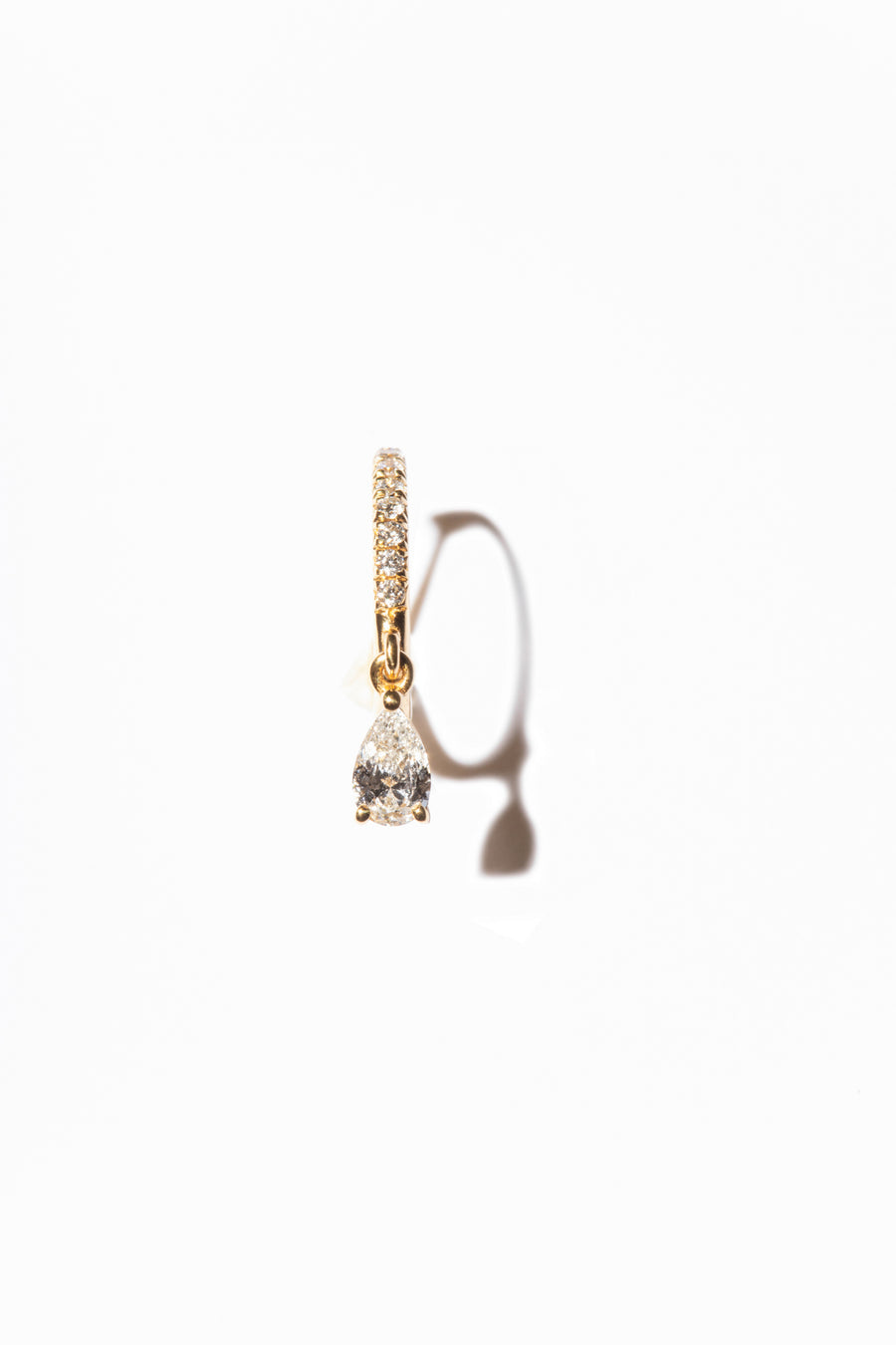 Elegant and timeless diamond earrings with pavé setting and pear-cut diamond, crafted from sustainable lab-grown diamonds and recycled gold. 