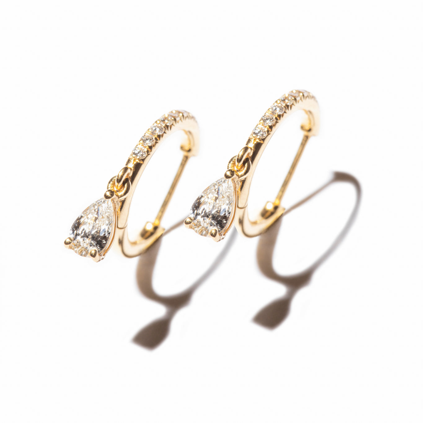 Pear Drop Pavé Huggies, elegant diamond earrings that are made of sustainable lab-grown diamonds and 18k solid gold. 
