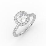 Elegant cushion-cut diamond solitaire engagement ring in white gold with a diamond Pavé band and Halo design.   