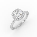 A white gold cushion-shaped solitaire engagement ring showcasing a brilliant 1 carat lab-grown diamond in halo setting. 