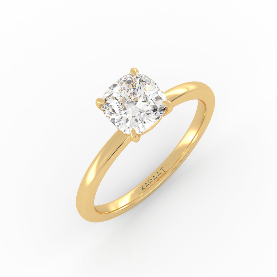 Cushion Solitaire engagement ring in the yellow gold 4-prong setting. 
