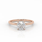 Lab-grown diamond engagement ring with a 1 carat cushion cut diamond in the rose gold band. 