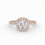 A refined cushion-cut diamond with Halo in a rose gold pavé band setting.