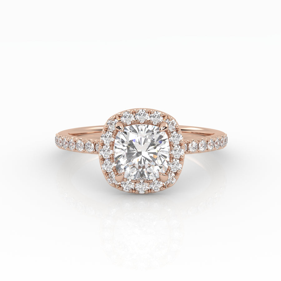 A refined cushion-cut diamond with Halo in a rose gold pavé band setting.