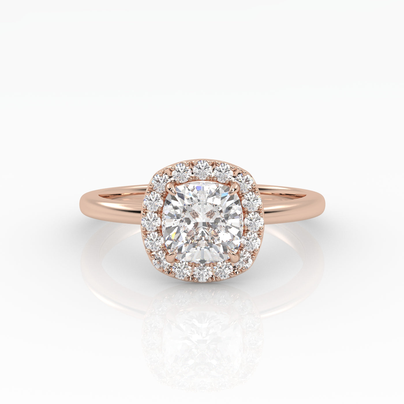 A dazzling cushion-cut diamond nestled on a sparkly halo setting and sophisticated rose gold band. 