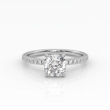 Elegant Cushion Solitaire Engagement Ring with sparkling pavé band shown in white gold. 