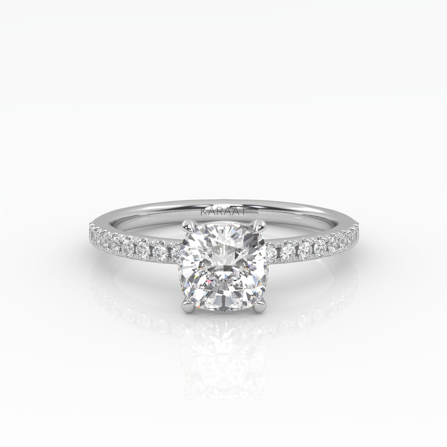 Elegant Cushion Solitaire Engagement Ring with sparkling pavé band shown in white gold. 