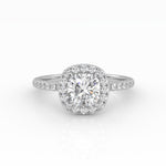 A dazzling cushion-cut diamond nestled on a stunning white gold Halo and Pavé band setting. 