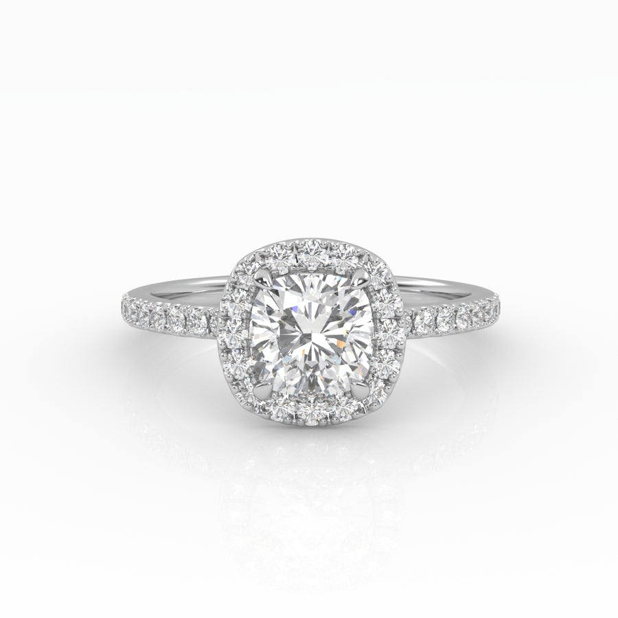 A dazzling cushion-cut diamond nestled on a stunning white gold Halo and Pavé band setting. 