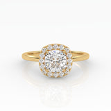 An exquisite yellow gold cushion-cut diamond ring featuring 1 carat diamond in a halo setting.