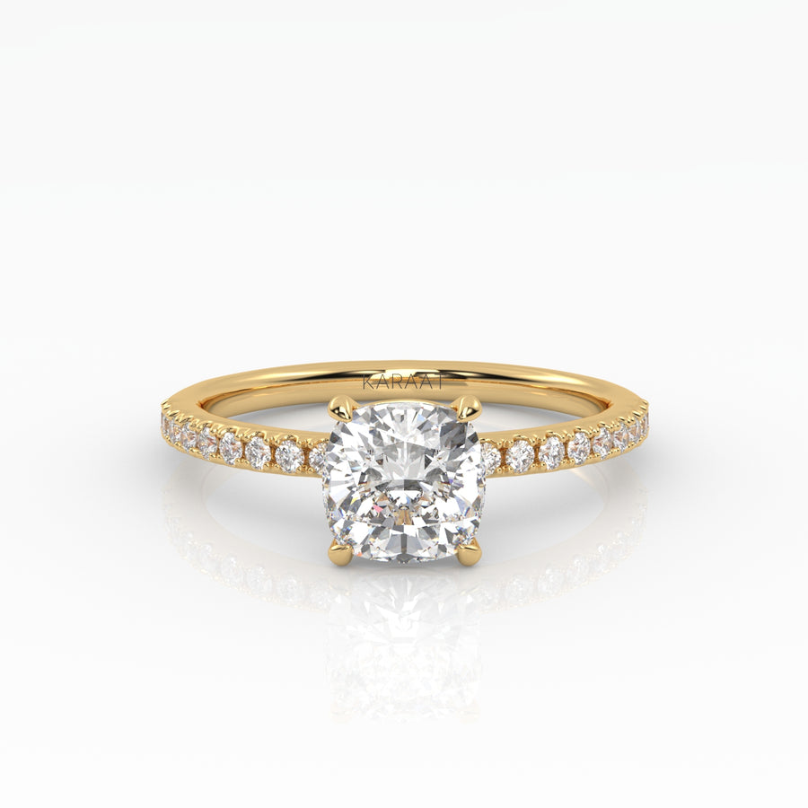 Timeless cushion-cut engagement ring with a lab-grown diamond and a delicate yellow gold pavé band.